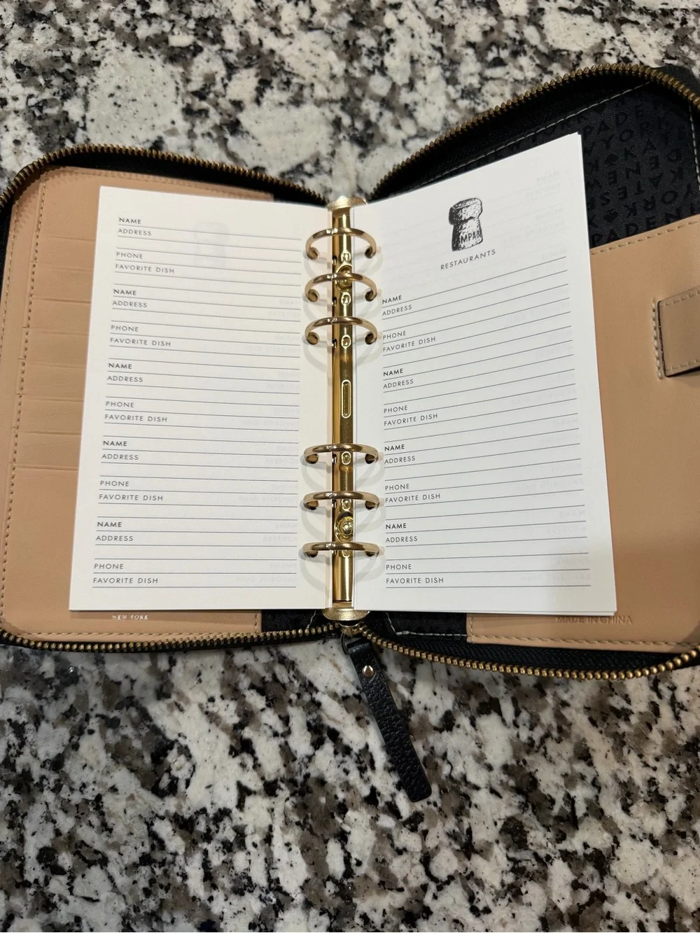 kate spade Black Pebbled Leather Zip Wallet with Gold Logo